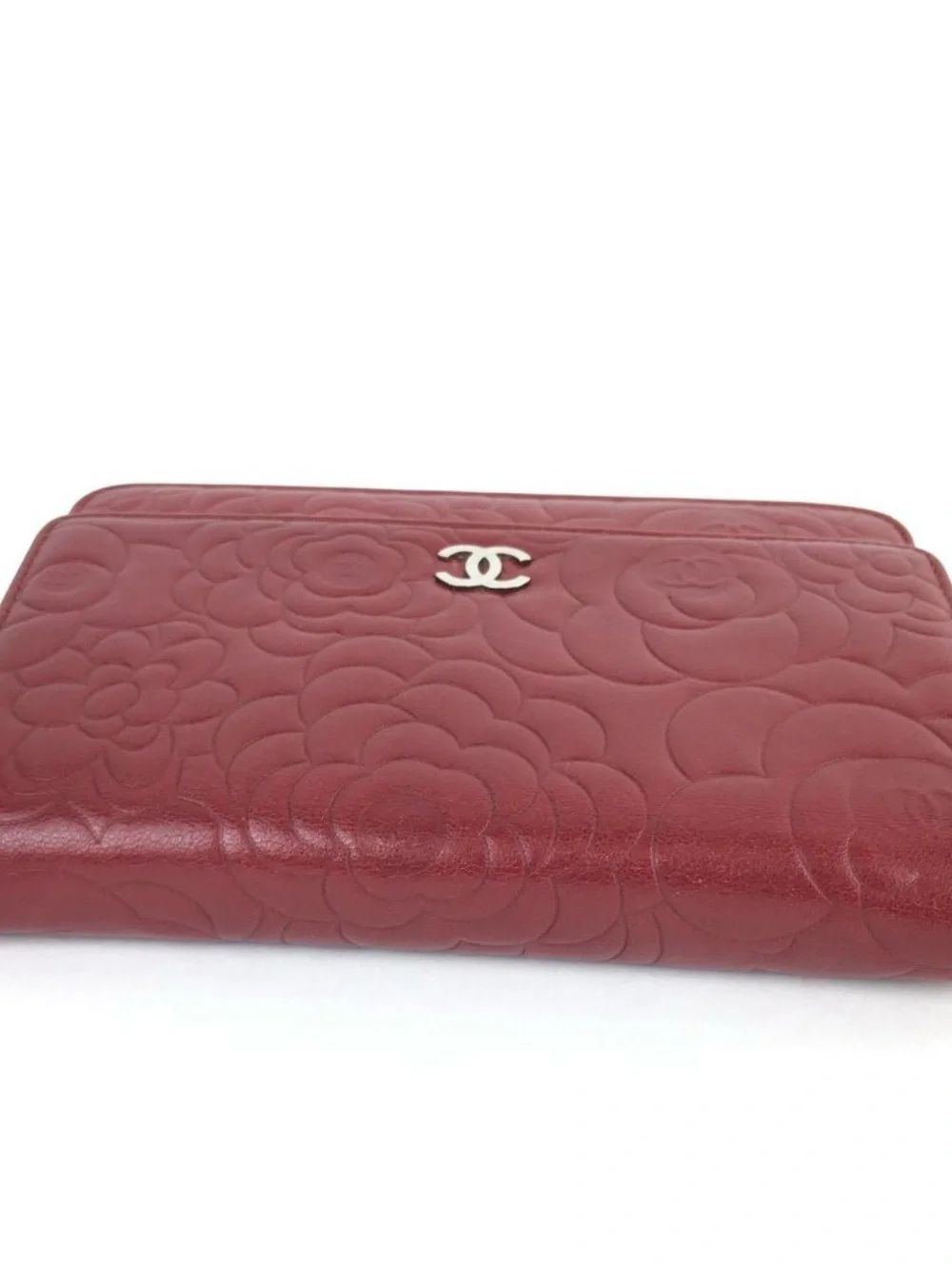 CHANEL Camellia-Embossed Leather Clutch in Deep Red with Silver CC